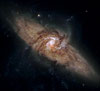Cпиральная галактика NGC3314, проецирующаяся на другую 
            (51кб)