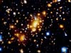 Эффект гравитационных линз, вызванный скоплением галактик Абель 2218 
            (26кб)