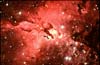 Mолодое скопление звезд (NGC 6611), которое сформировалось около 2 млн. лет назад 
            (36кб)